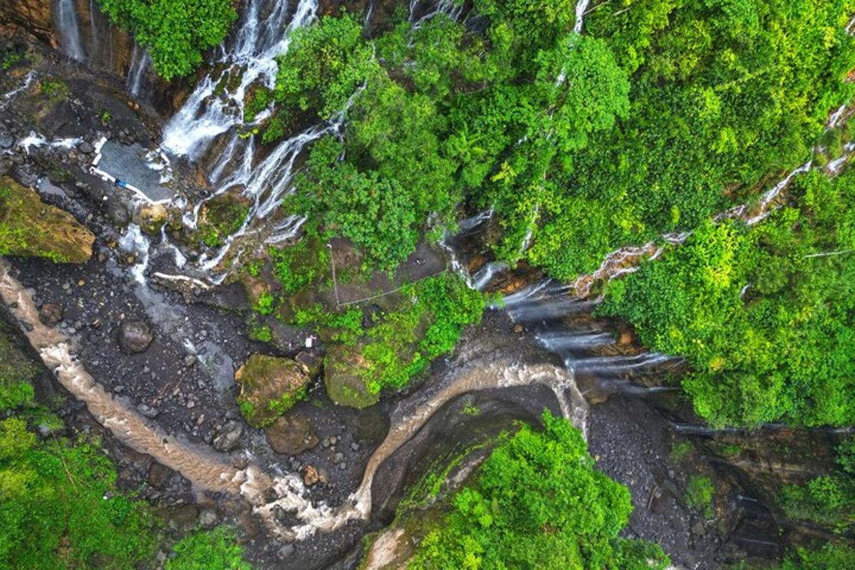 an aerial view of a waterfall and a river