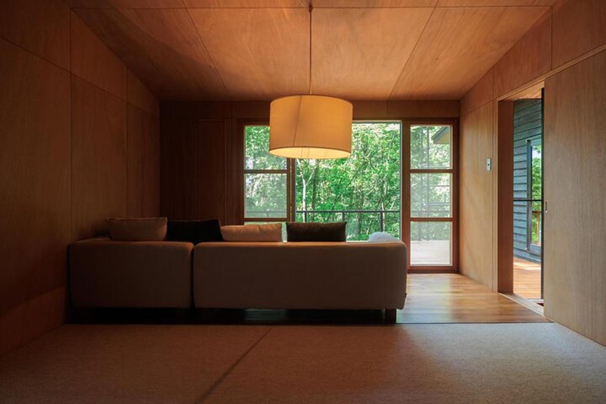 a living room with a couch and a large window