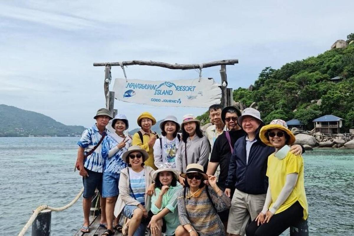 a group of people on a boat in the water