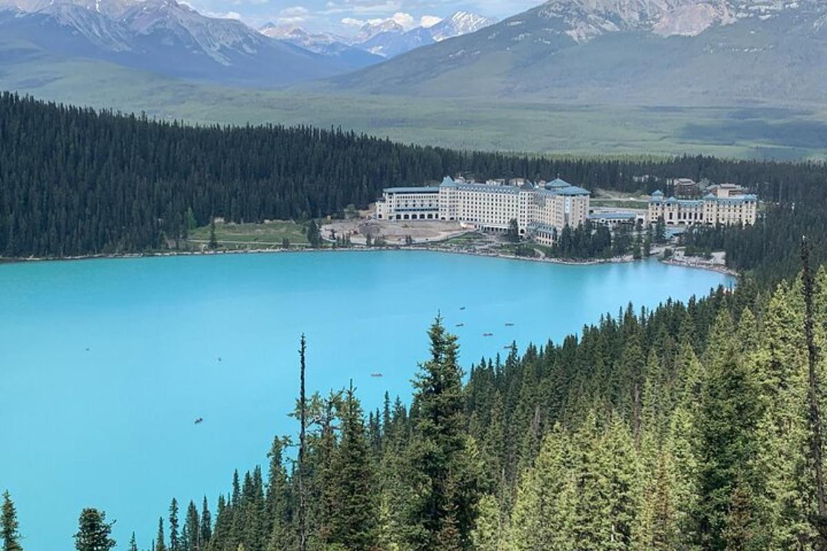 a view of a large blue lake with mountains