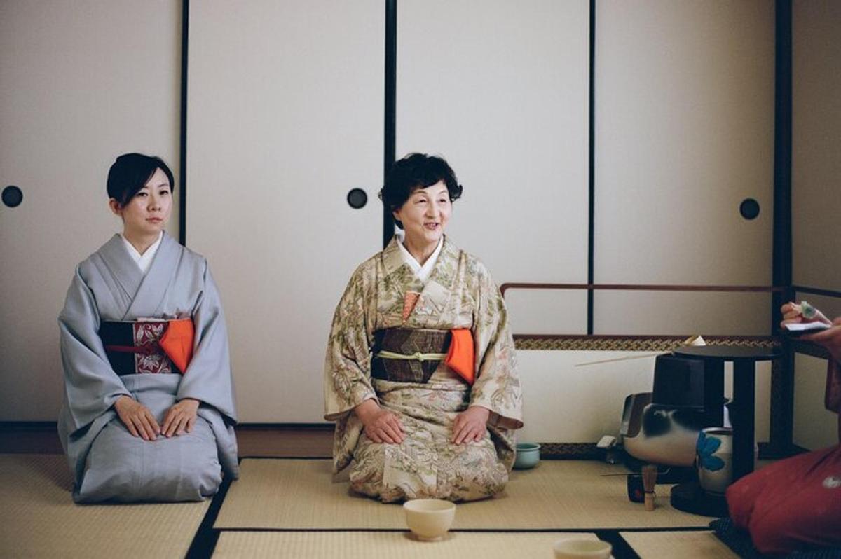 two women sitting on the floor in a room