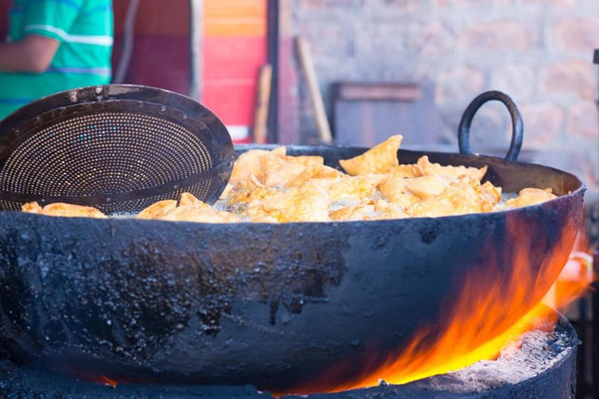 a pot of food is cooking on a fire