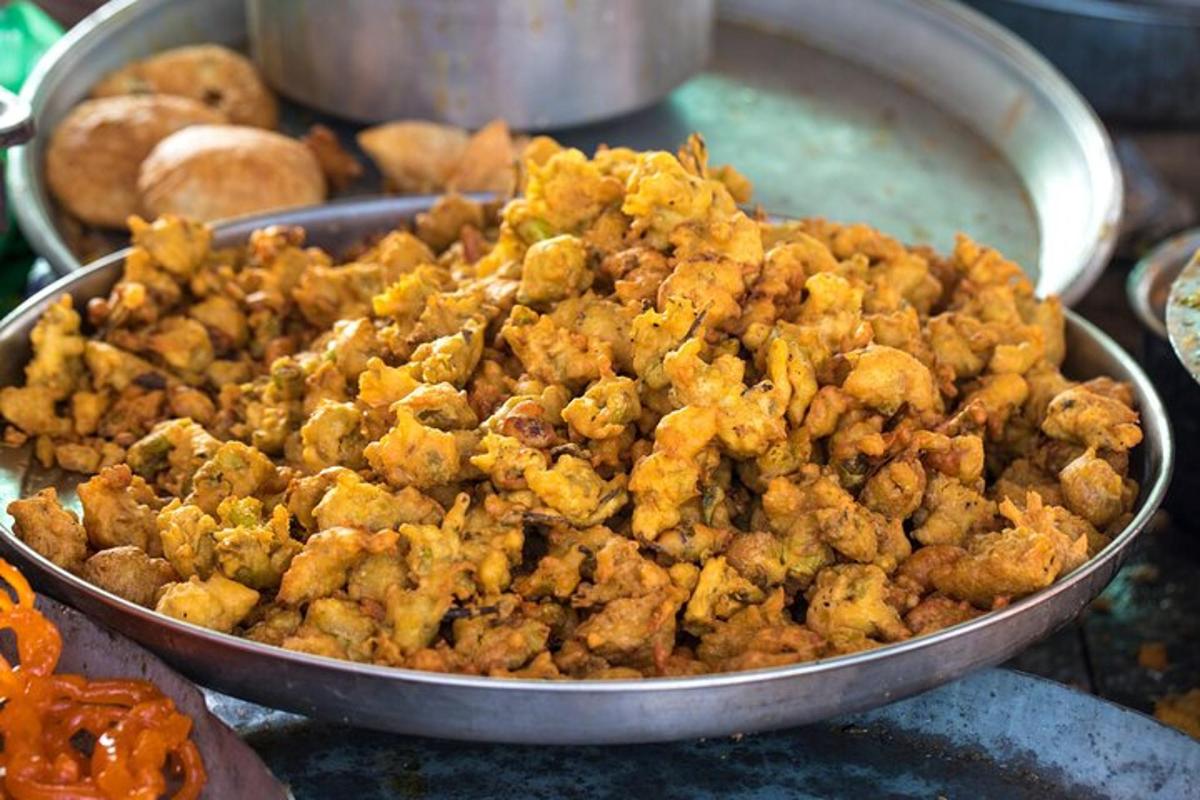 a pan filled with fried food on a table