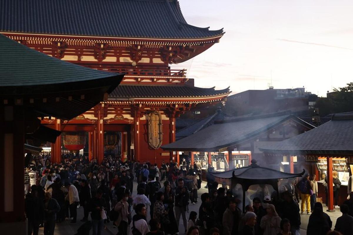a crowd of people walking in front of a building