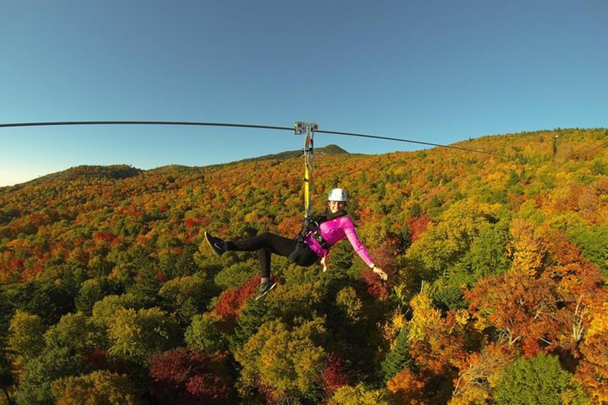 a person is hanging from a helicopter
