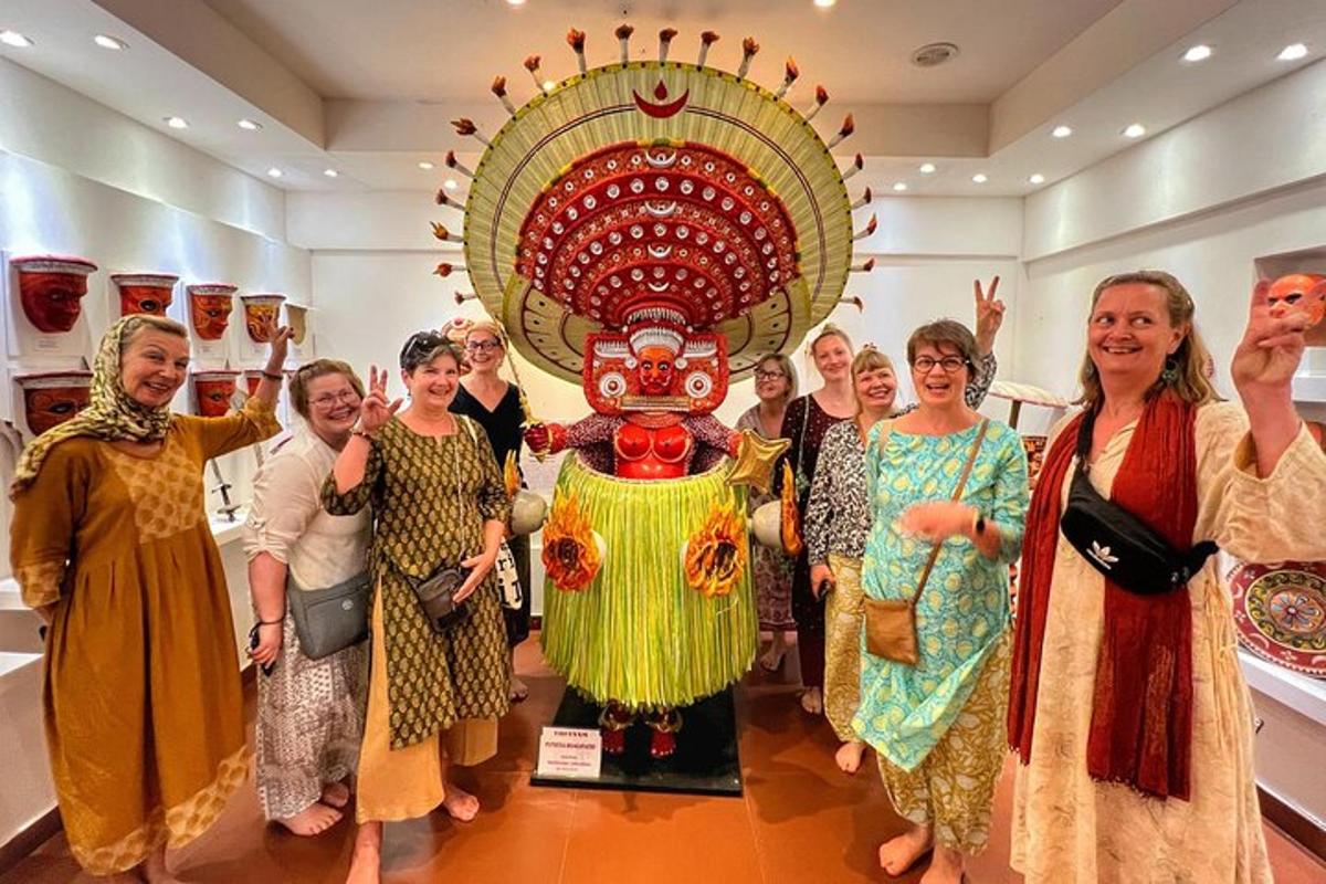 a group of women standing in front of a statue