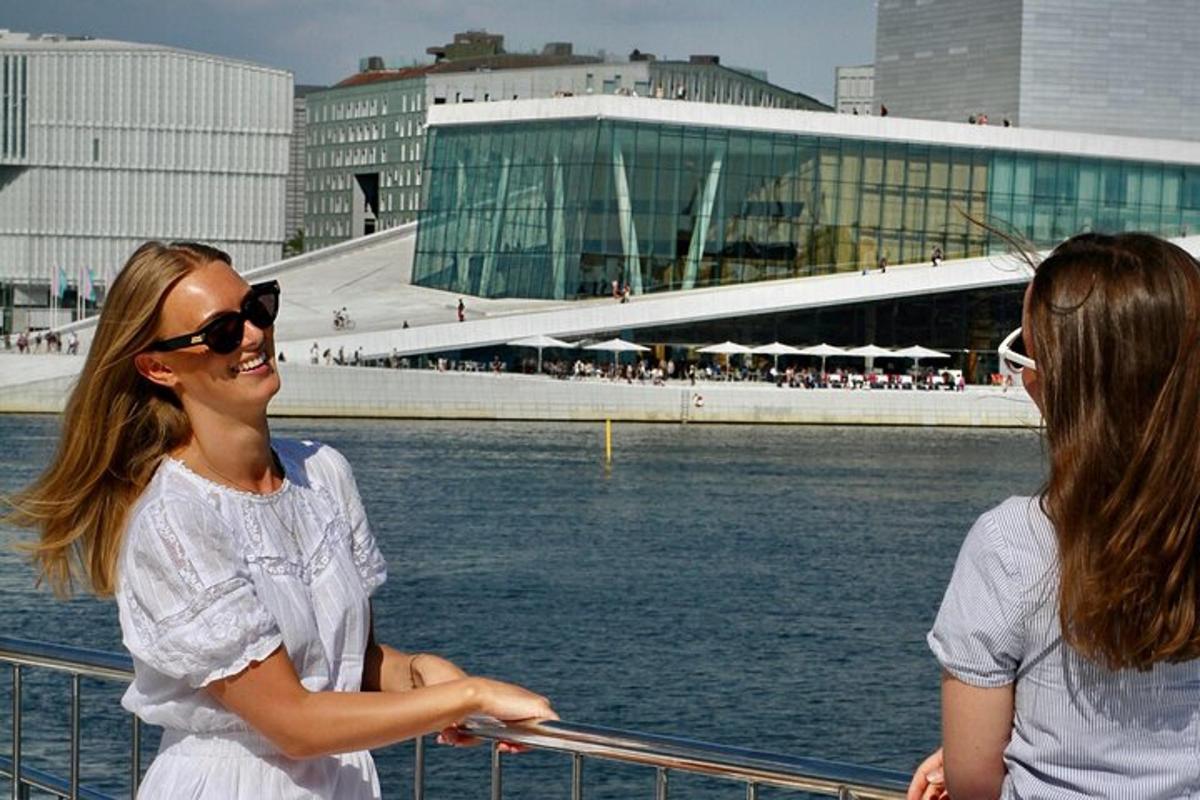 two women standing on a boat in the water