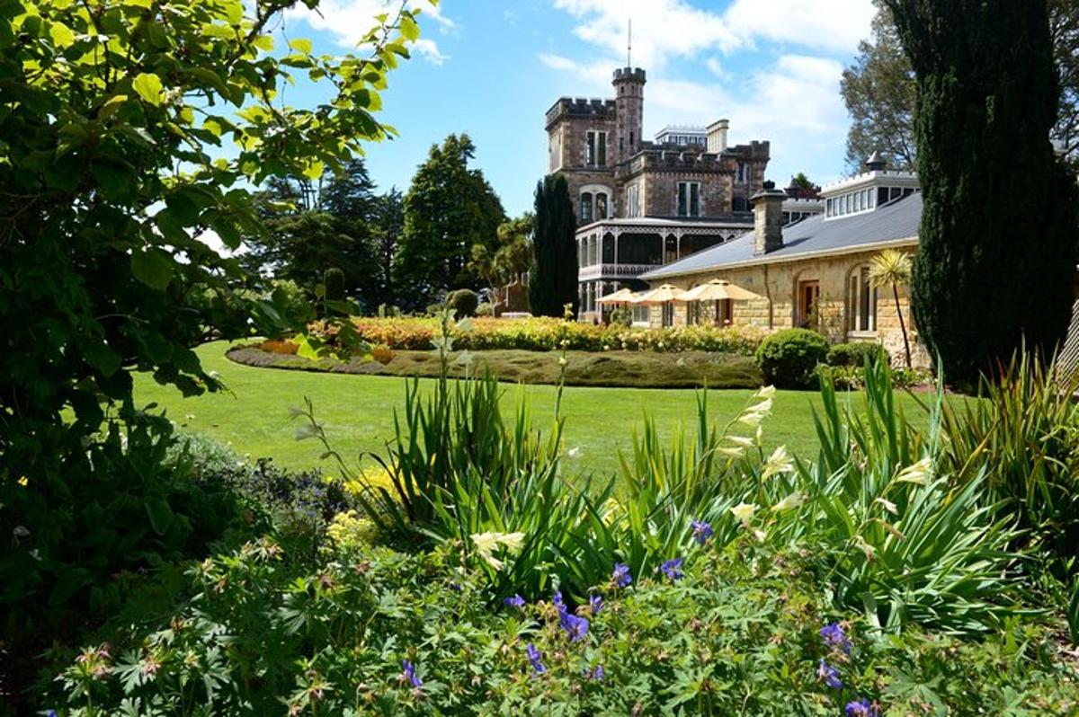 an old house with a garden in front of it