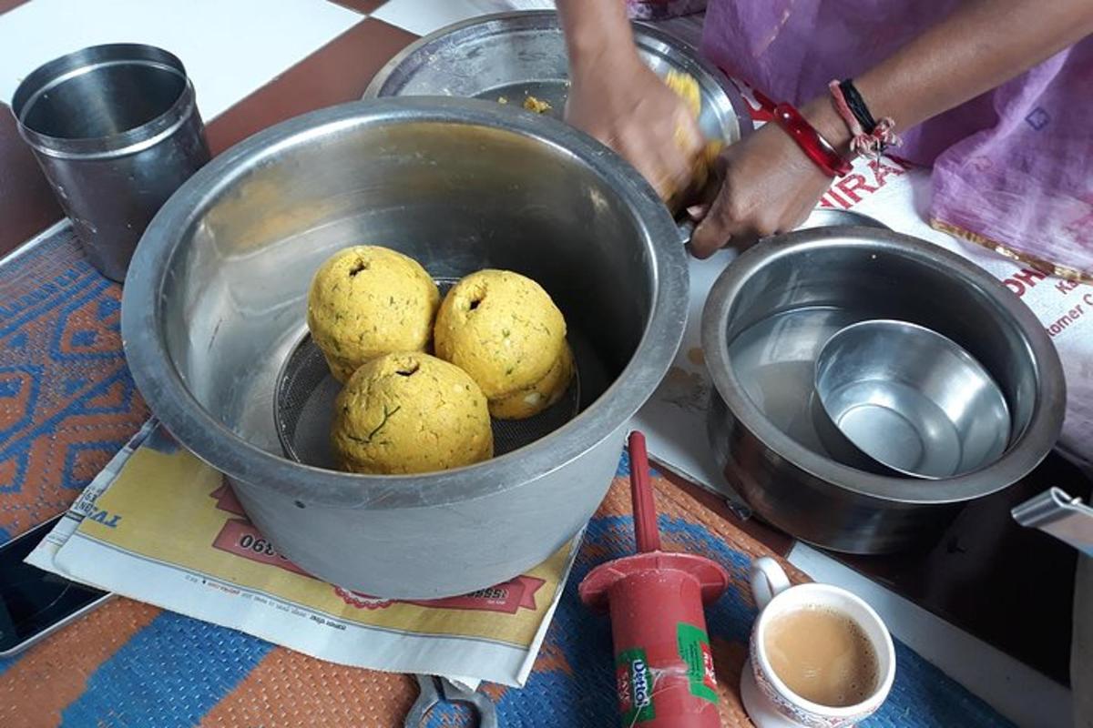 a bucket of potatoes sitting on top of a counter