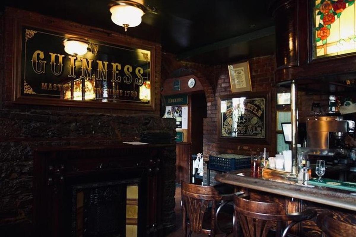 a bar with a fireplace in a pub