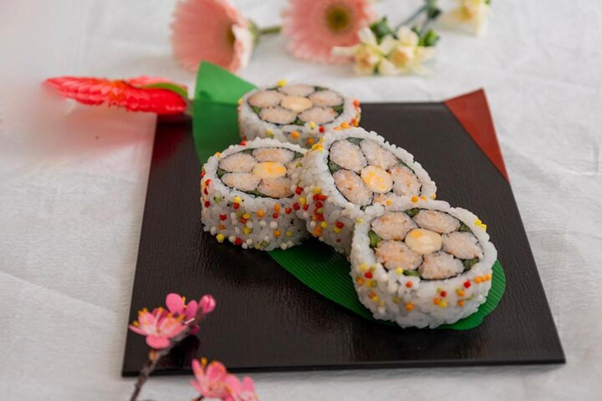 a group of sushi on a plate on a table