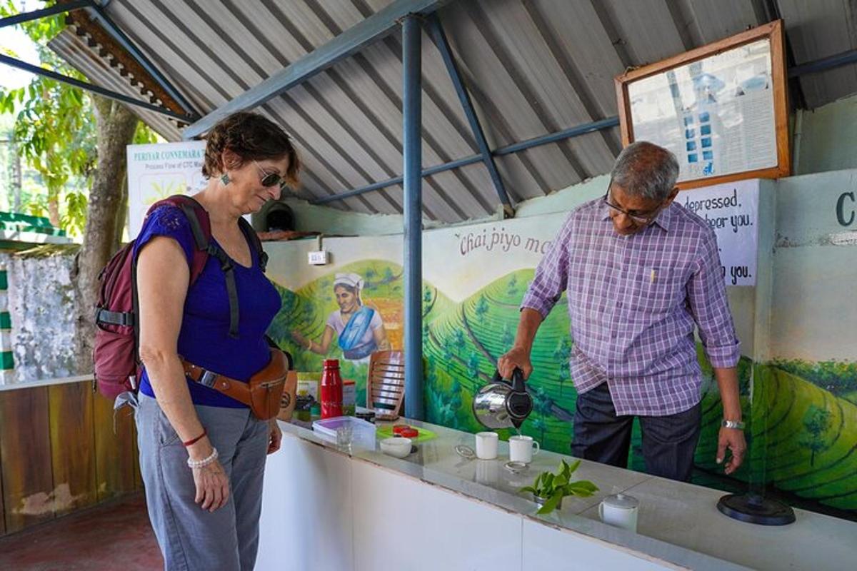 a man and a woman standing at a food stand