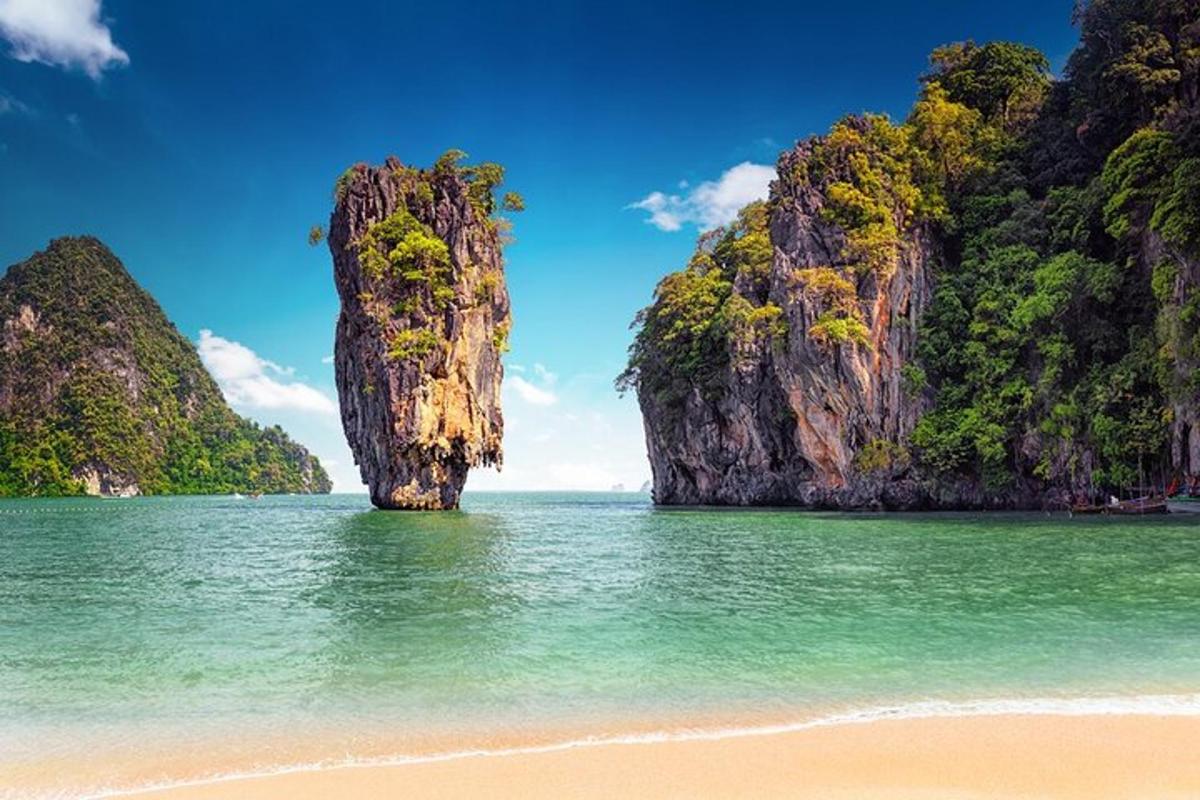 a beach with a rock formation in the water