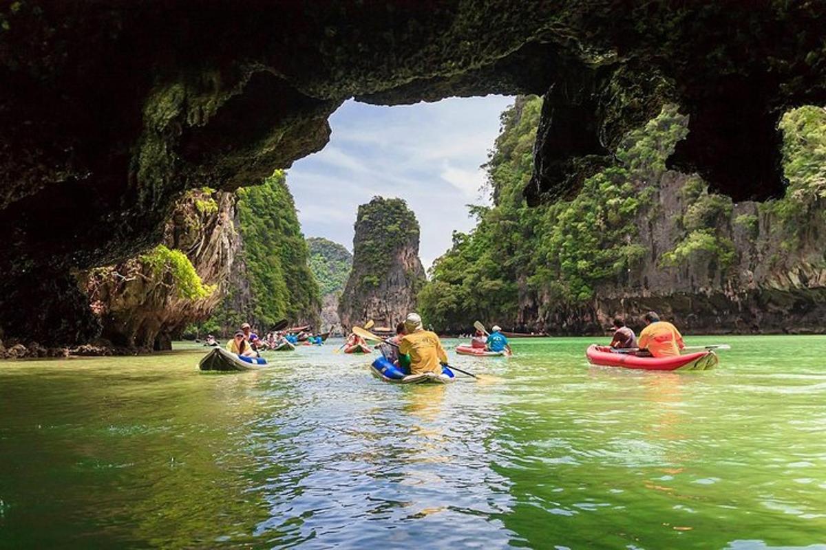 a group of people kayaking in a river in a cave