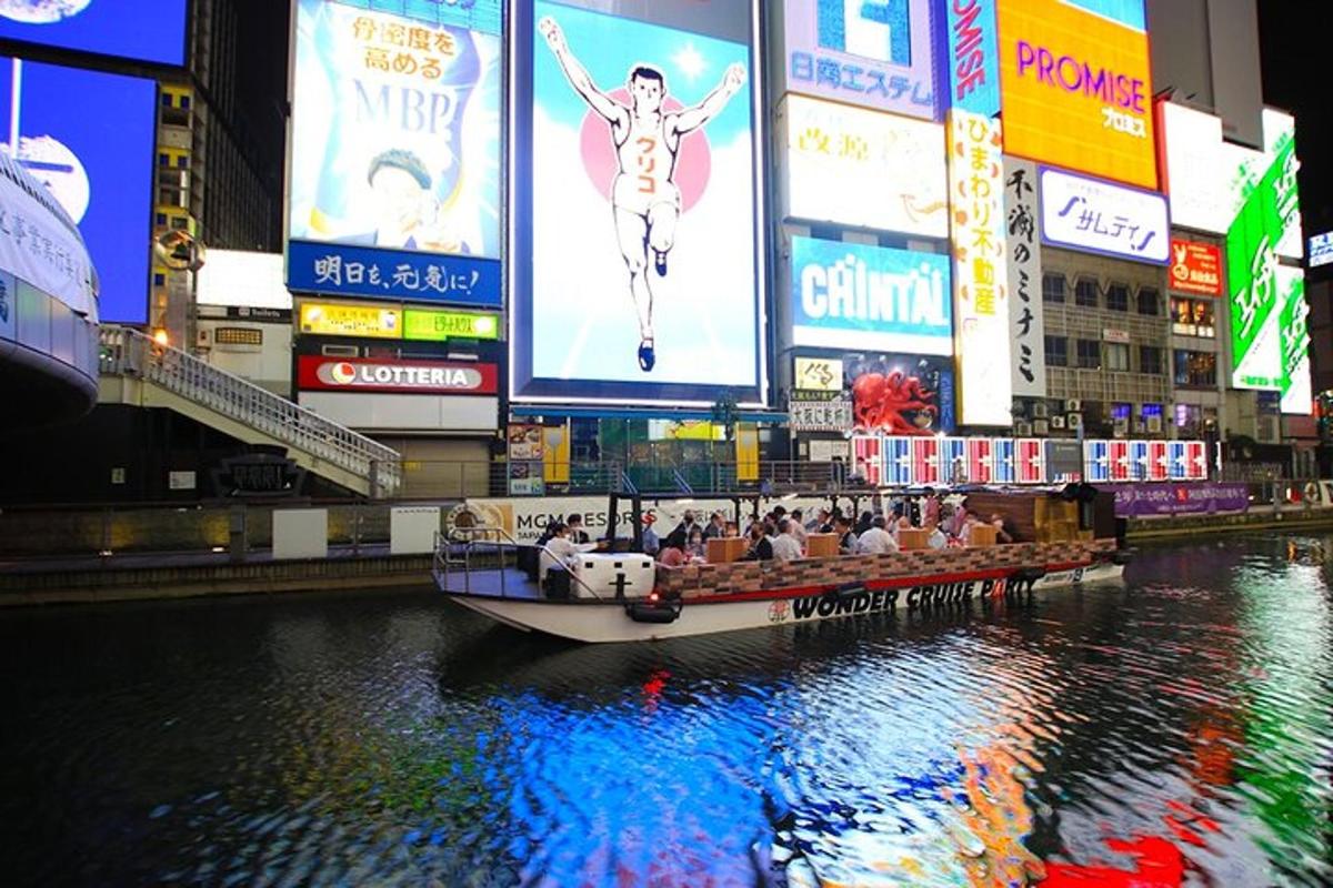a boat in a river in a city with billboards