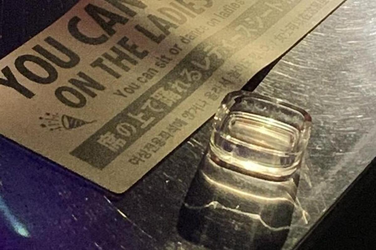a book and a glass of water on a table