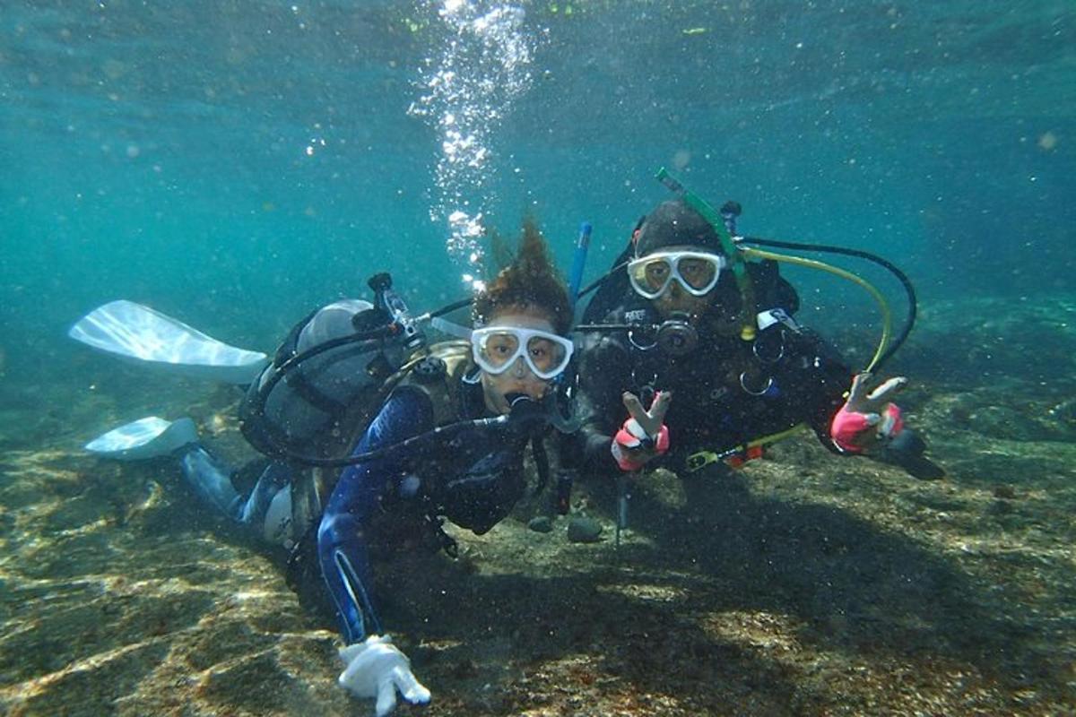 two people in the water posing for a picture