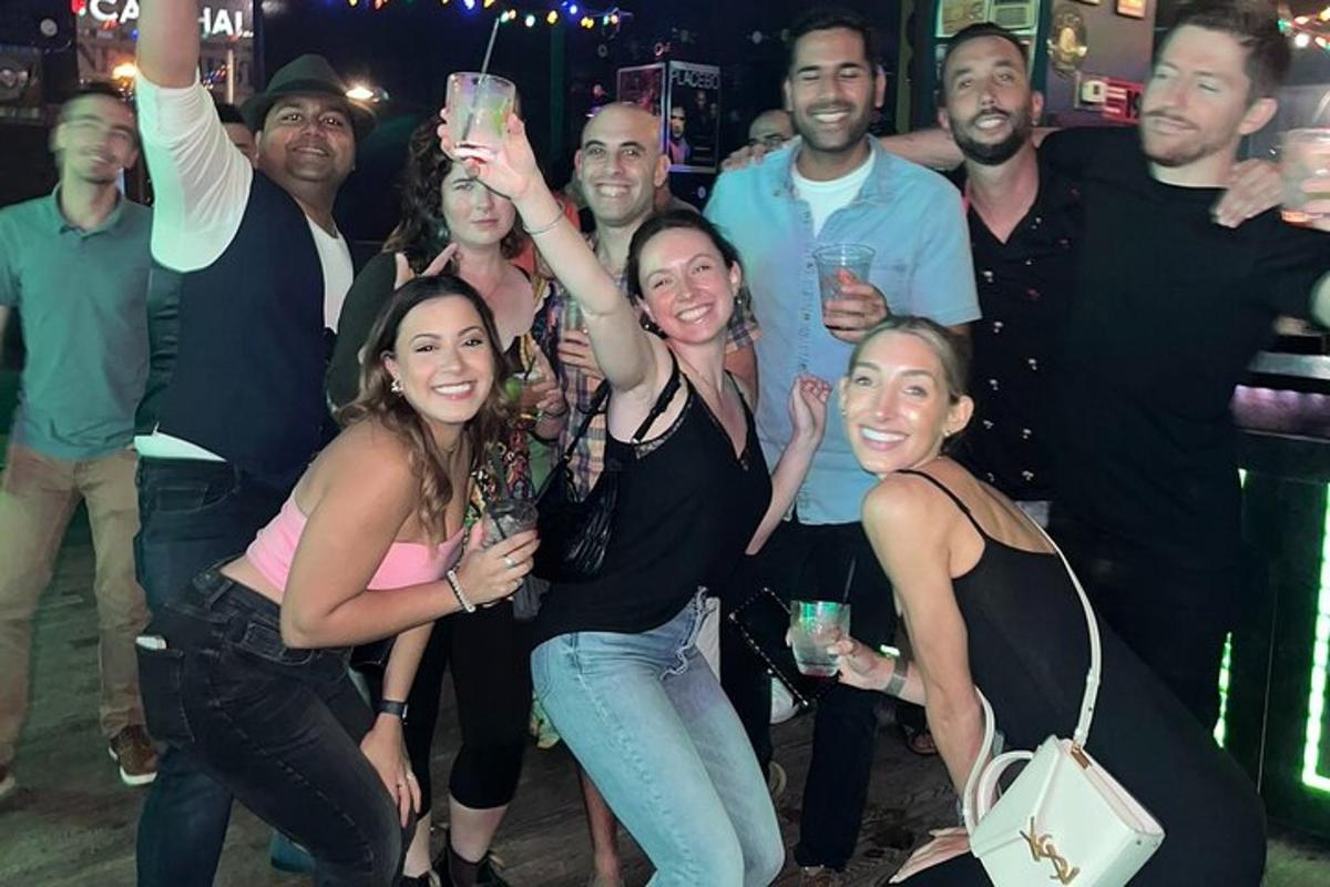 a group of people posing for a picture at a party