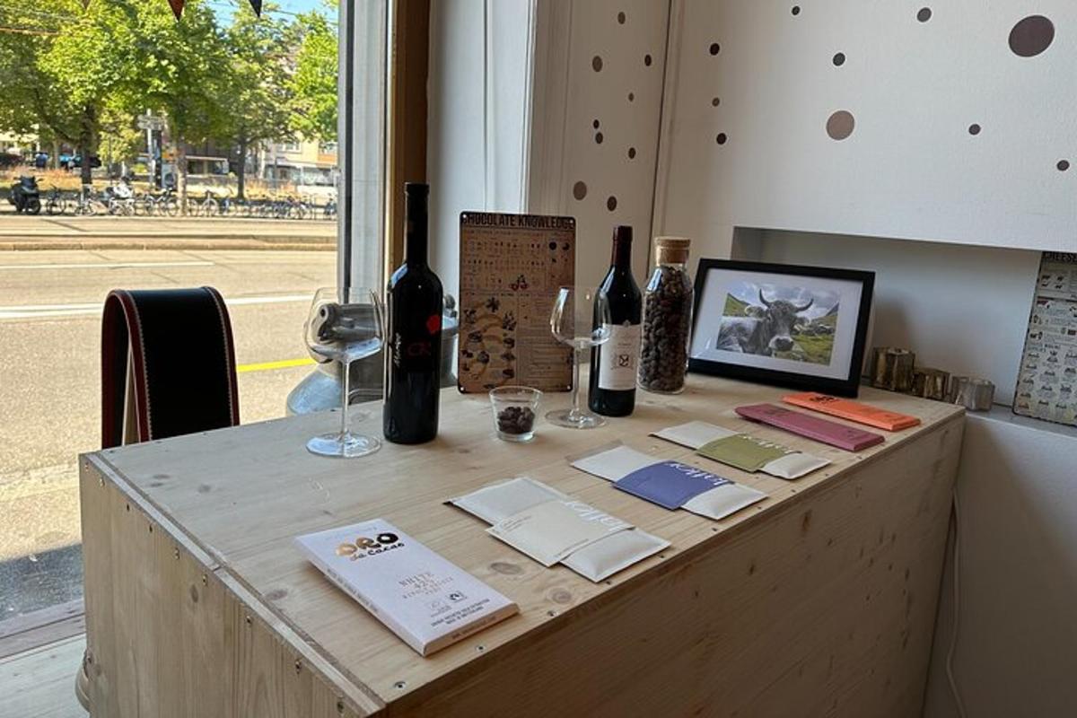 a table with wine glasses and wine bottles on it
