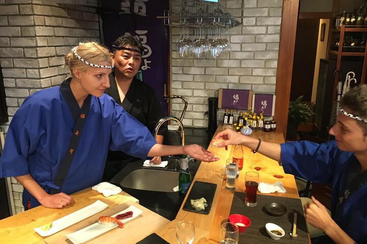 a group of three people sitting at a table