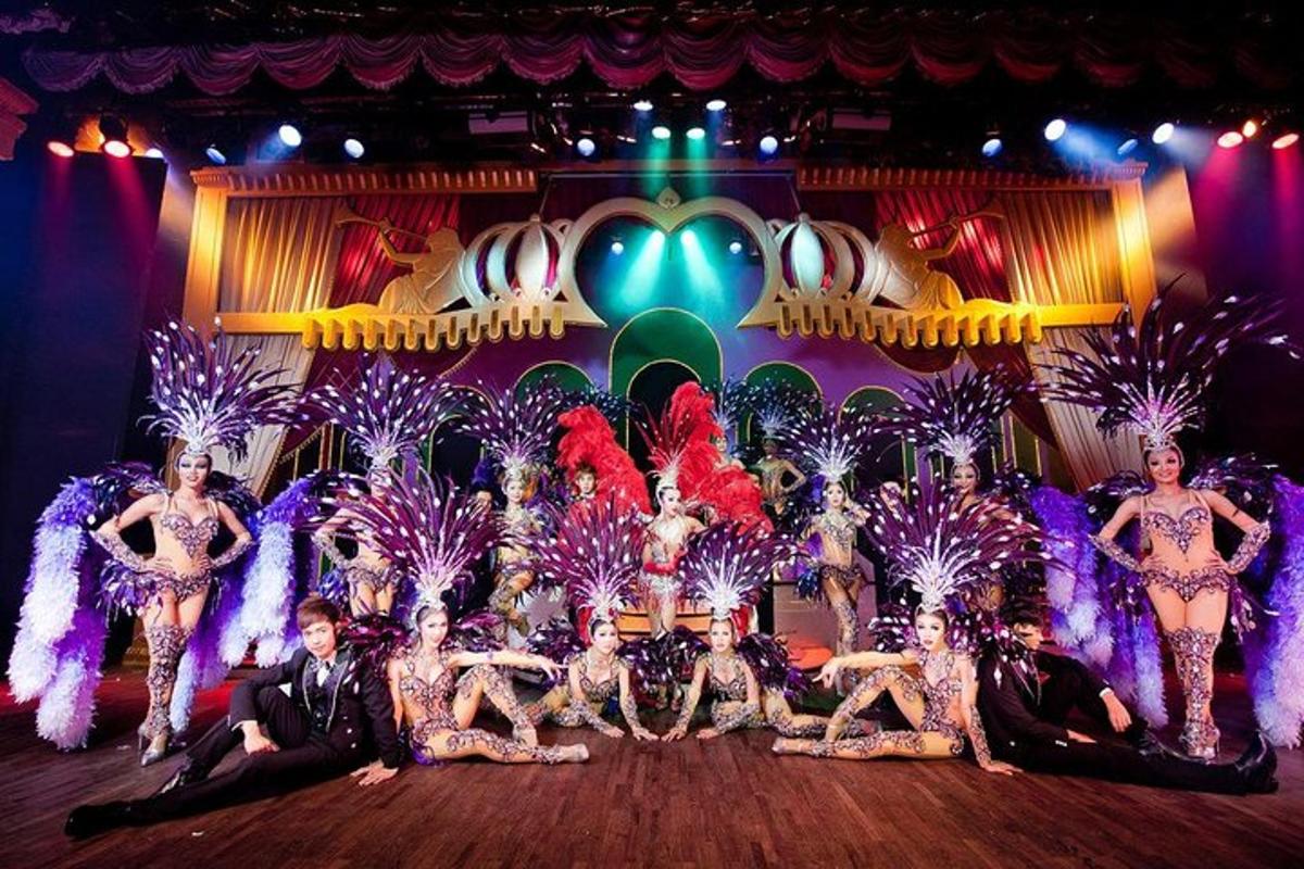 a group of women in costumes on a stage