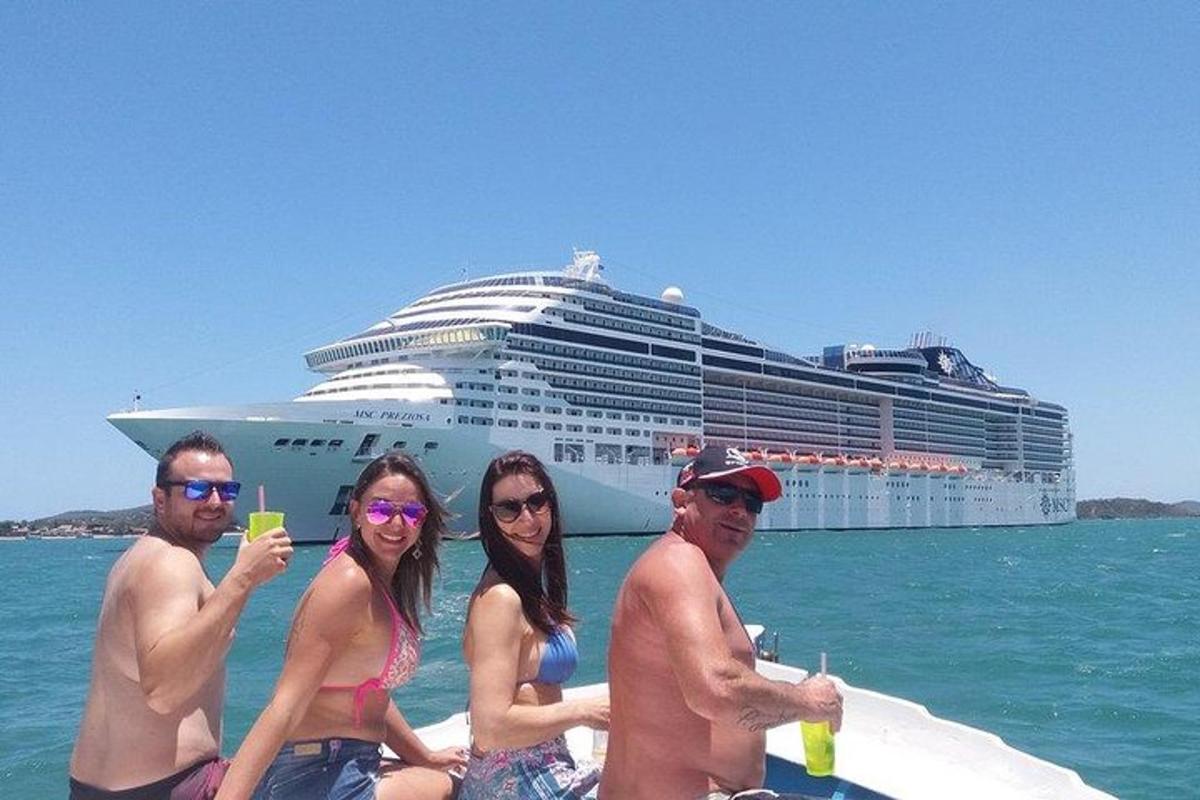 a group of people sitting on a boat with a cruise ship