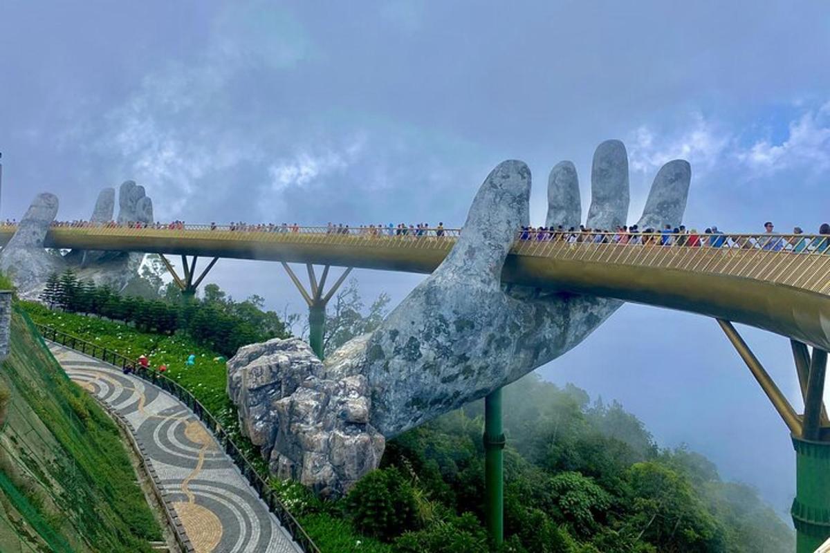 a bridge with a large statue of a hand