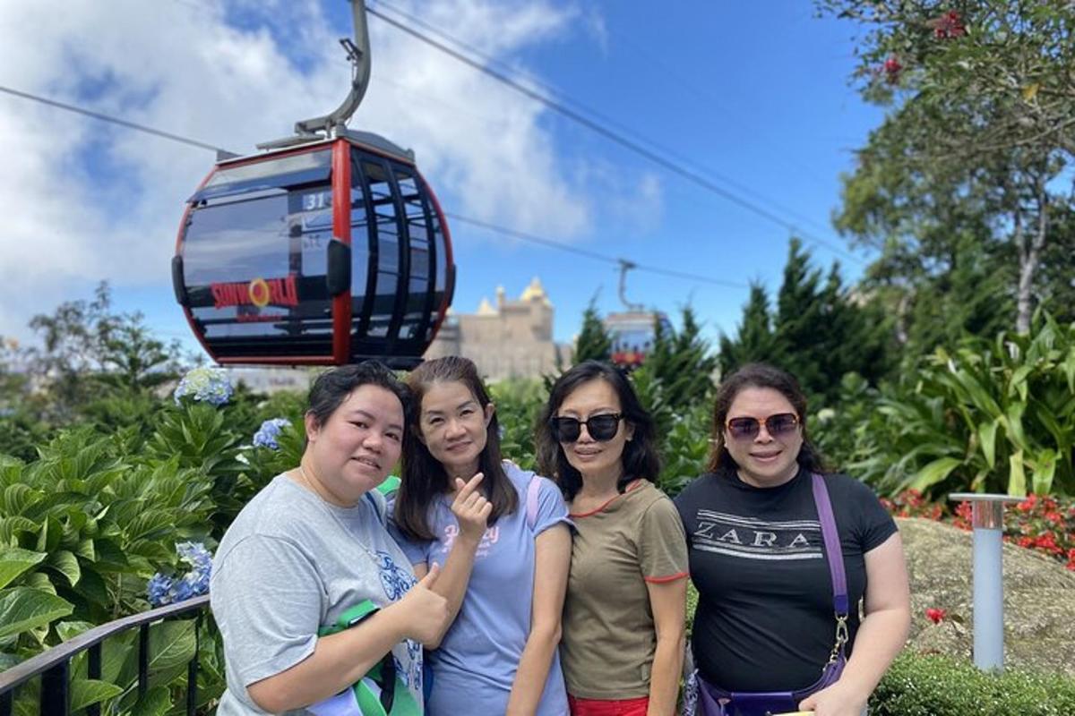 a group of women standing in front of a tram