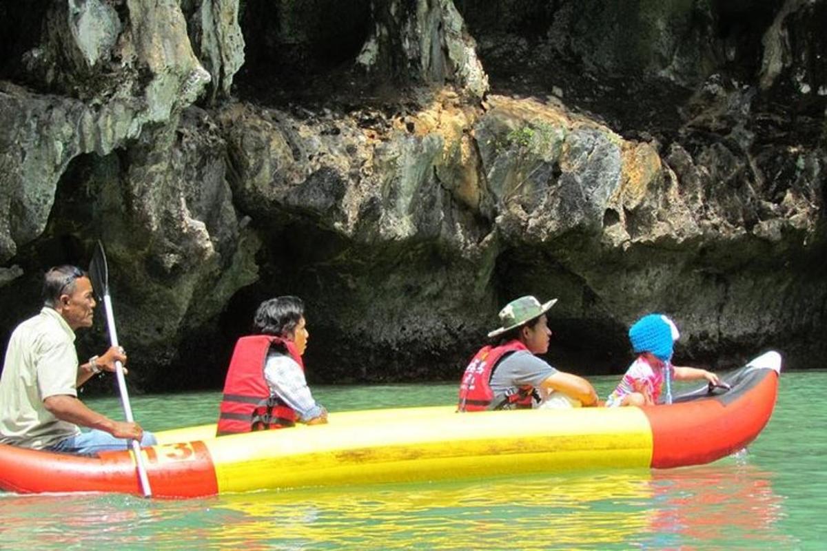 a group of people in a raft in the water