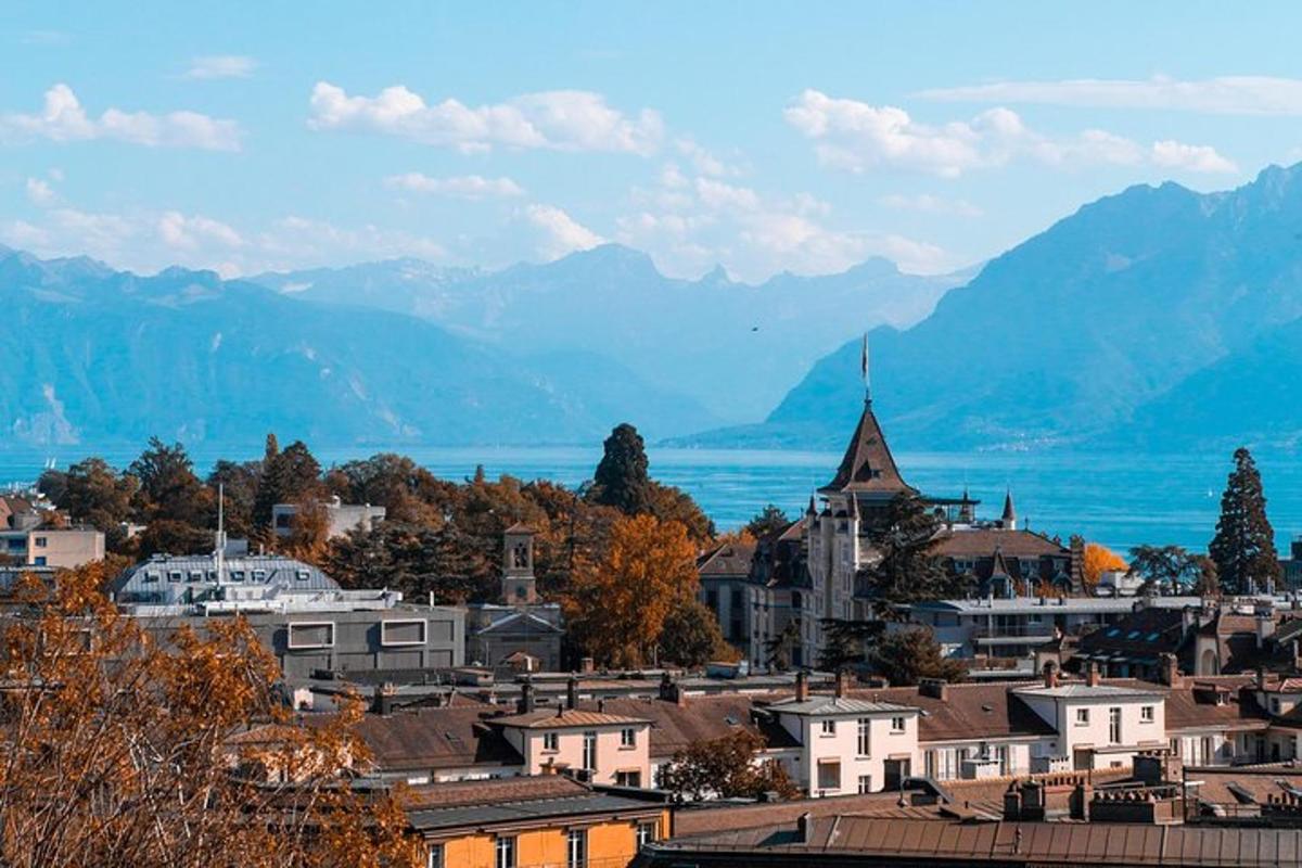 a town with mountains in the background and a city