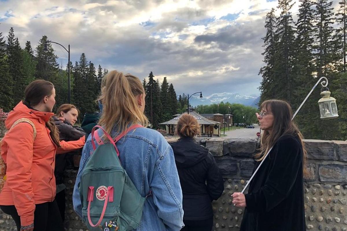 a group of people standing next to a stone wall