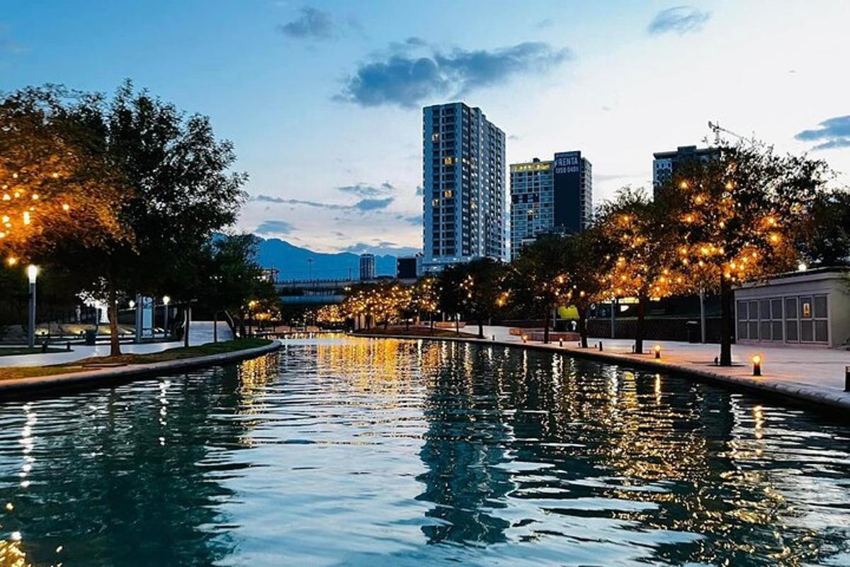 a river in a city with buildings in the background