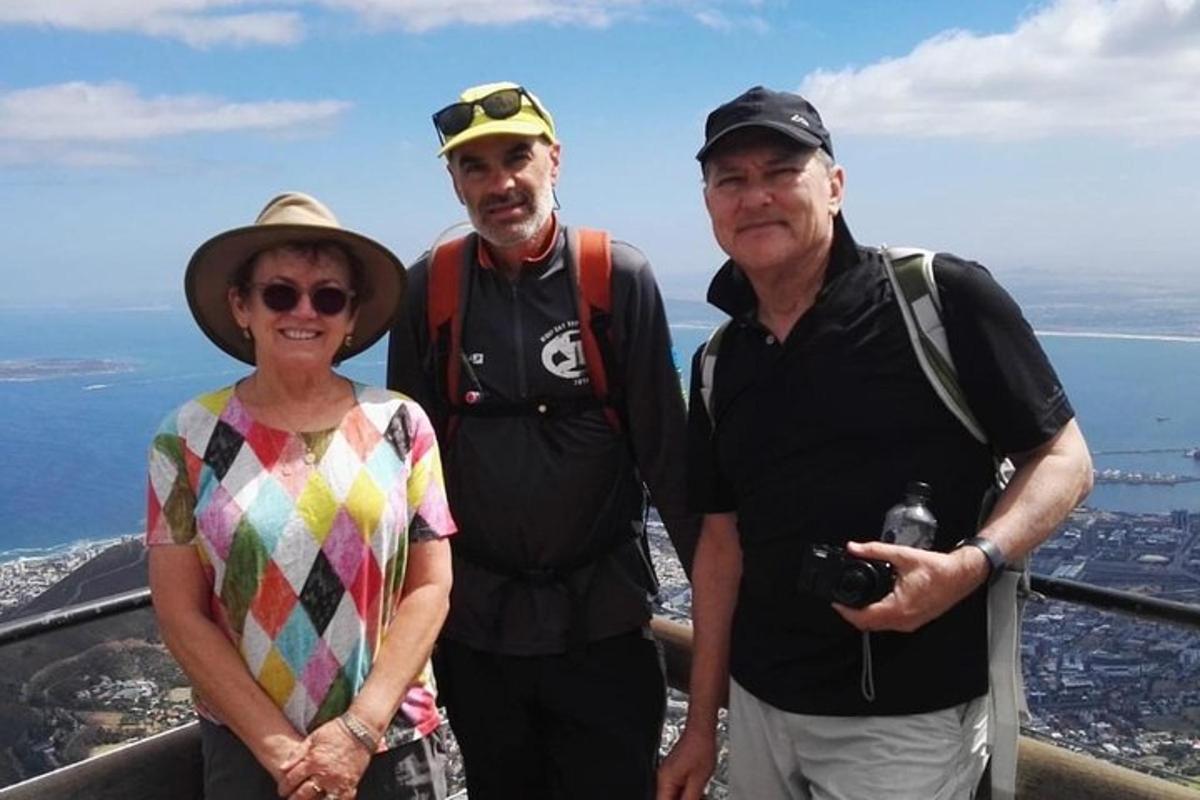 a group of people standing at the top of a mountain