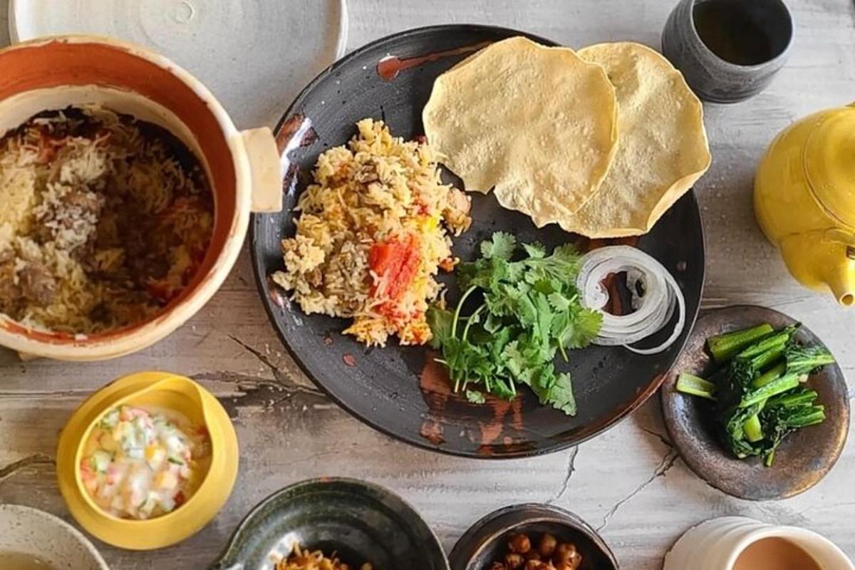 a table with a plate of food with rice and vegetables
