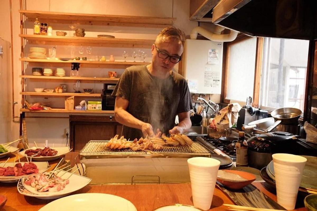 a man standing in a kitchen preparing food