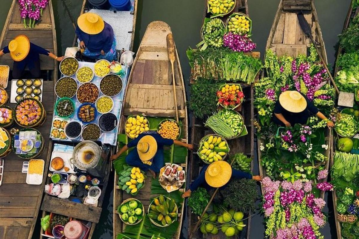 a group of people in boats filled with fruits and vegetables