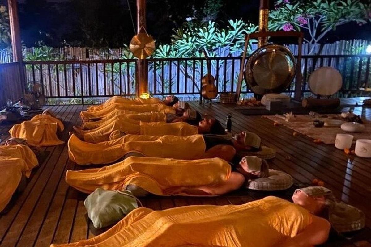 a group of people laying on the floor in sleeping bags