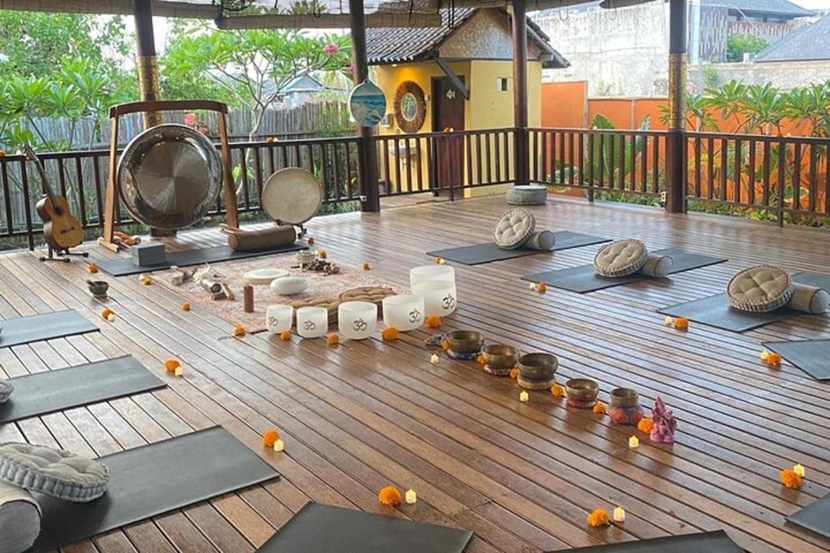 a room with yoga mats on a wooden deck