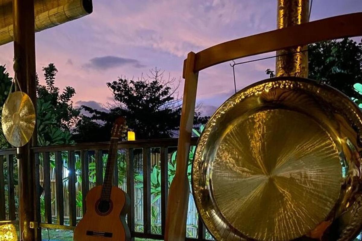 a guitar and a guitar swing on a porch