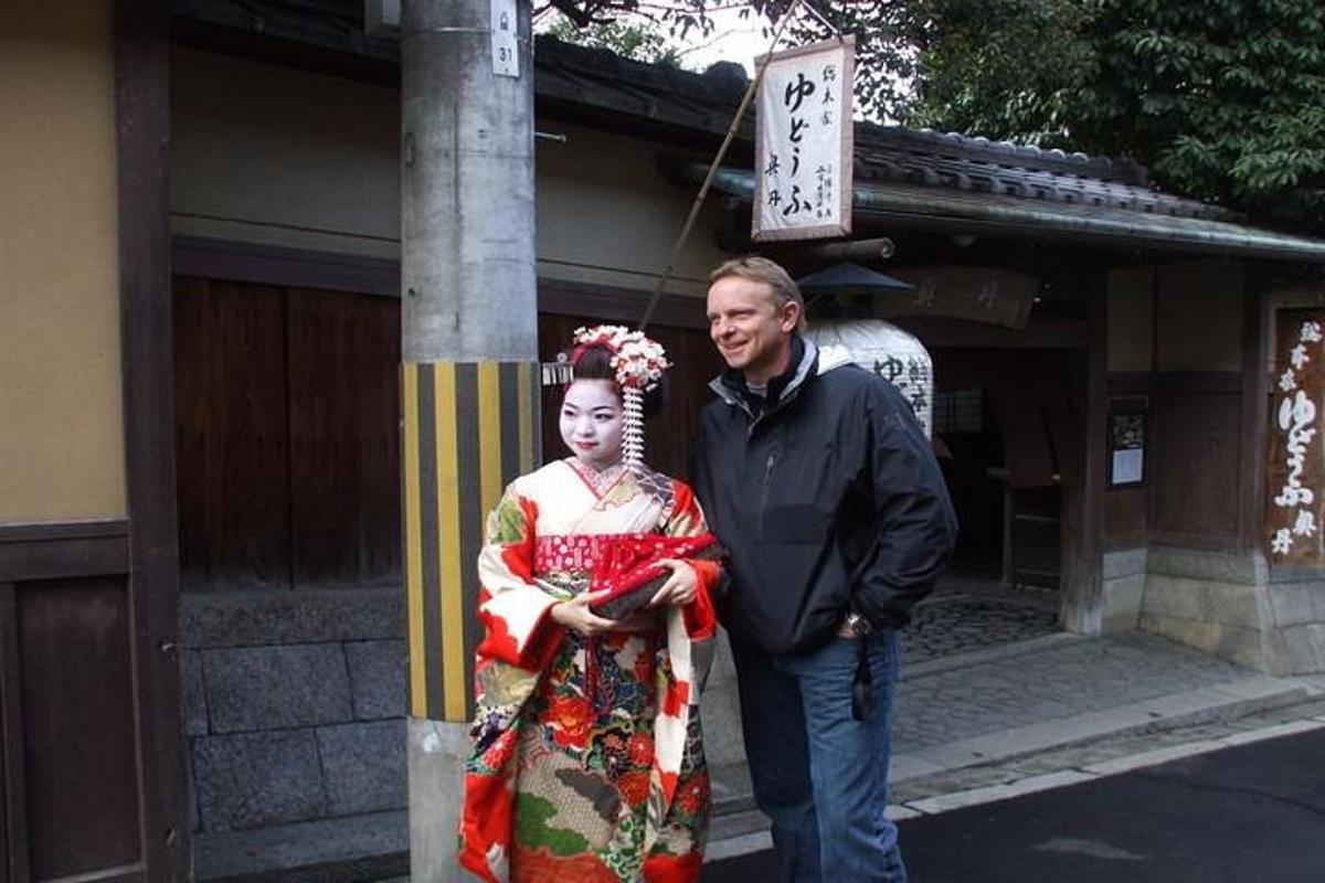 a man and a woman standing next to a pole