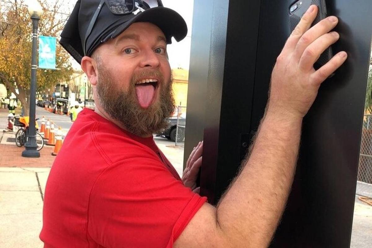 a man with his tongue hanging out of a wall