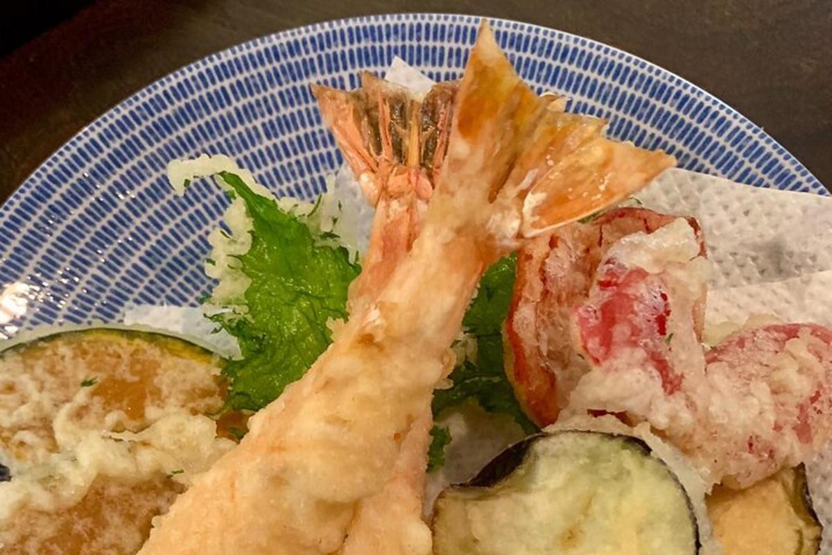 a plate of food with shrimp and vegetables on it