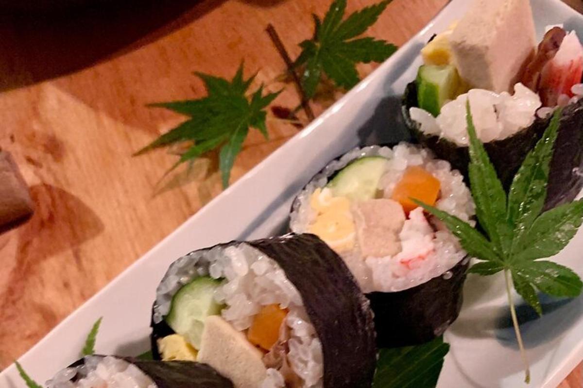 a white plate of sushi on a table