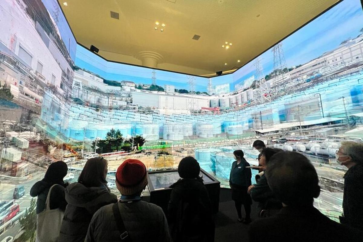 a group of people looking at a large exhibit in a stadium