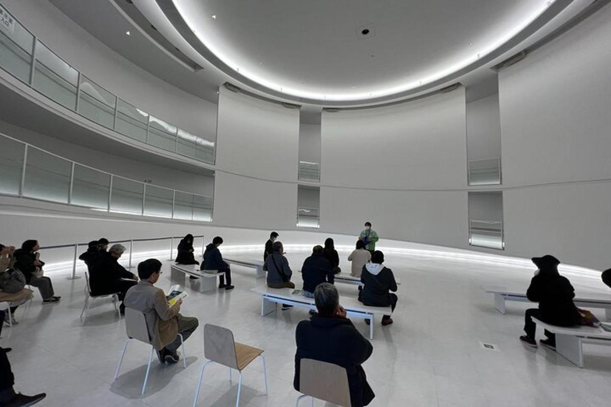 a group of people sitting in chairs in a building