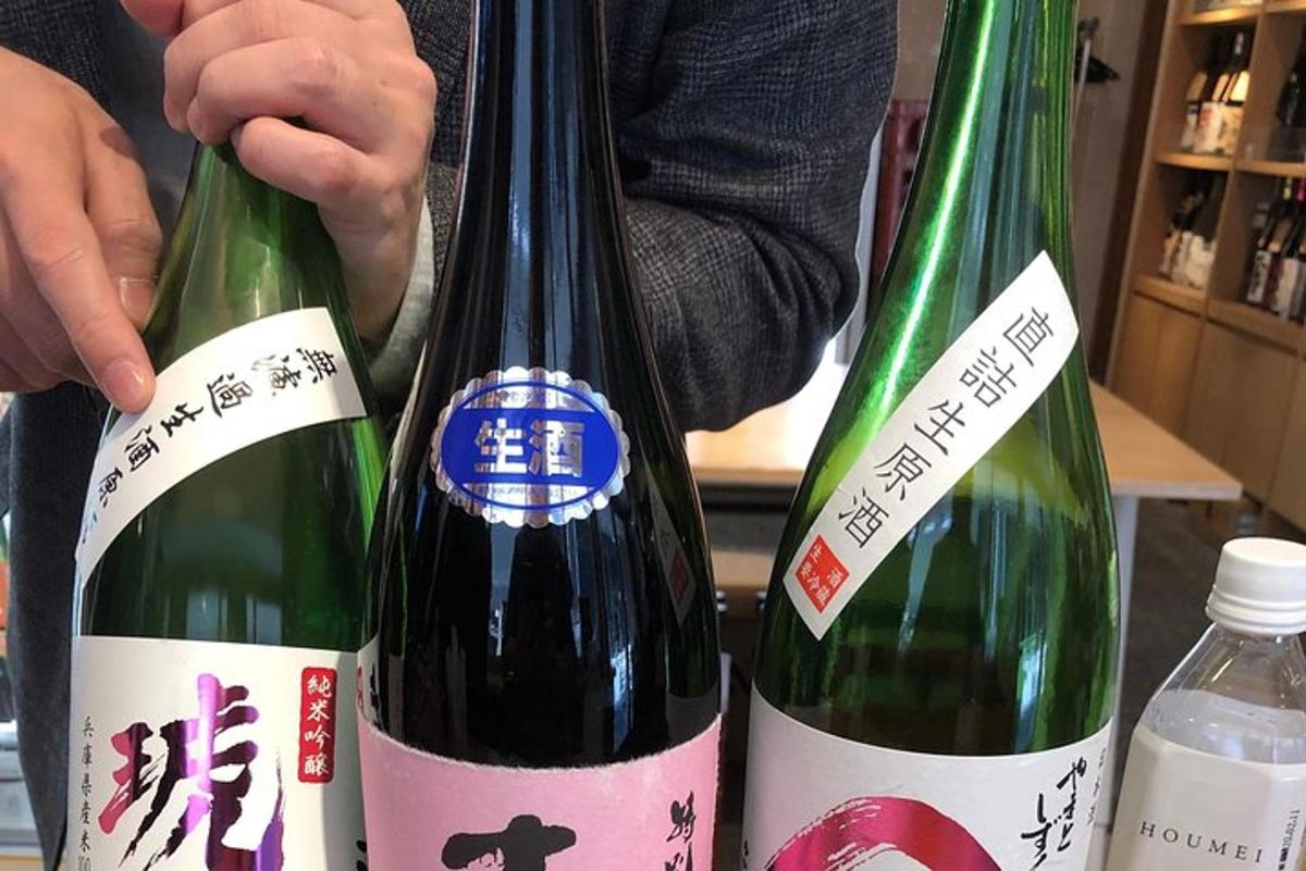 a person holding two bottles of wine