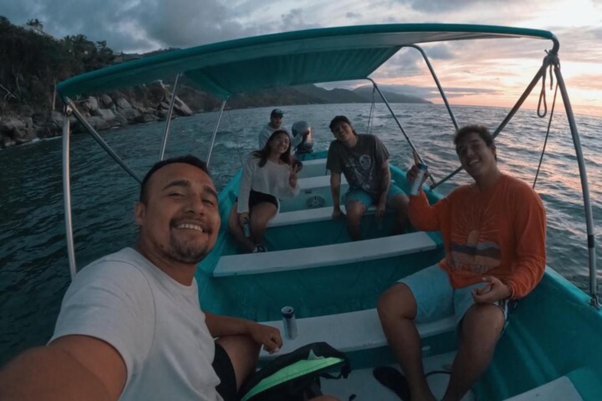 a group of people sitting on a boat in the water