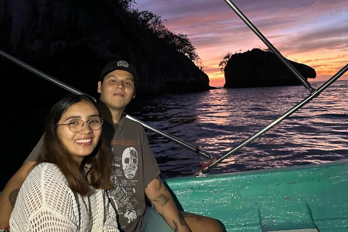 a man and a woman on a boat in the ocean