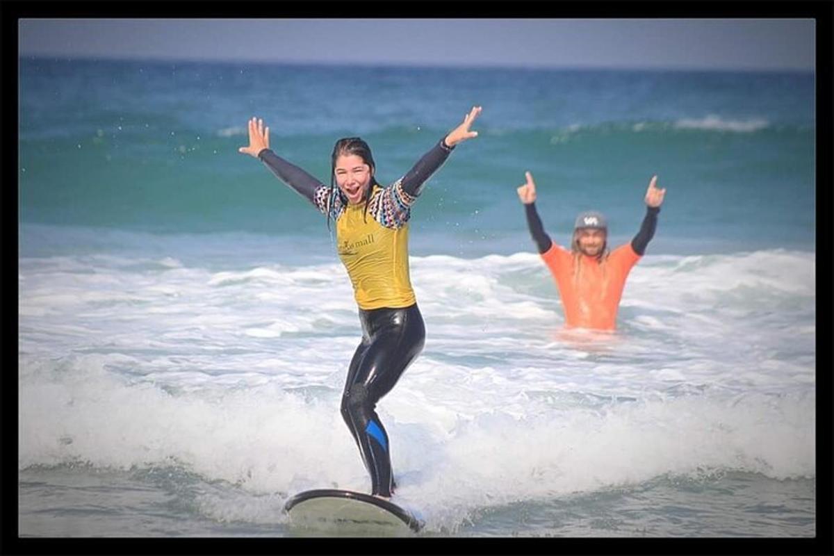 a woman riding a wave on a surfboard in the ocean