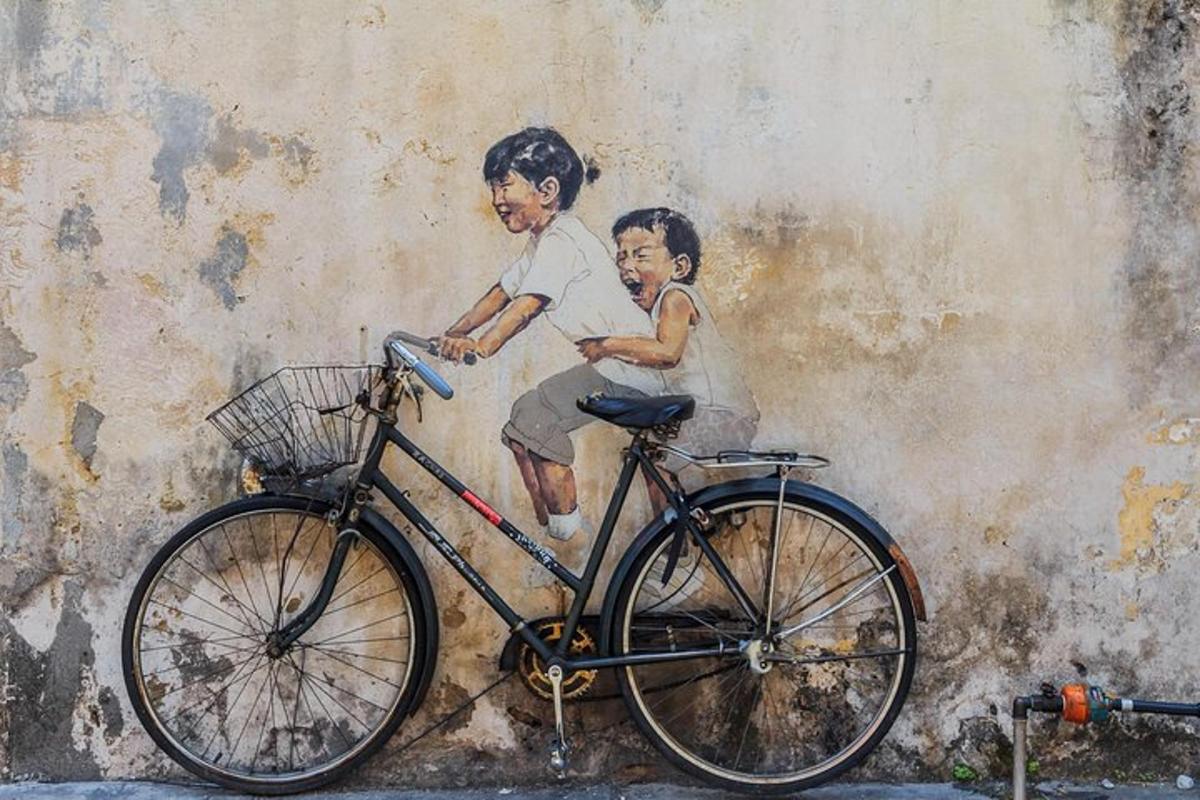 a painting of a boy and a child on a wall